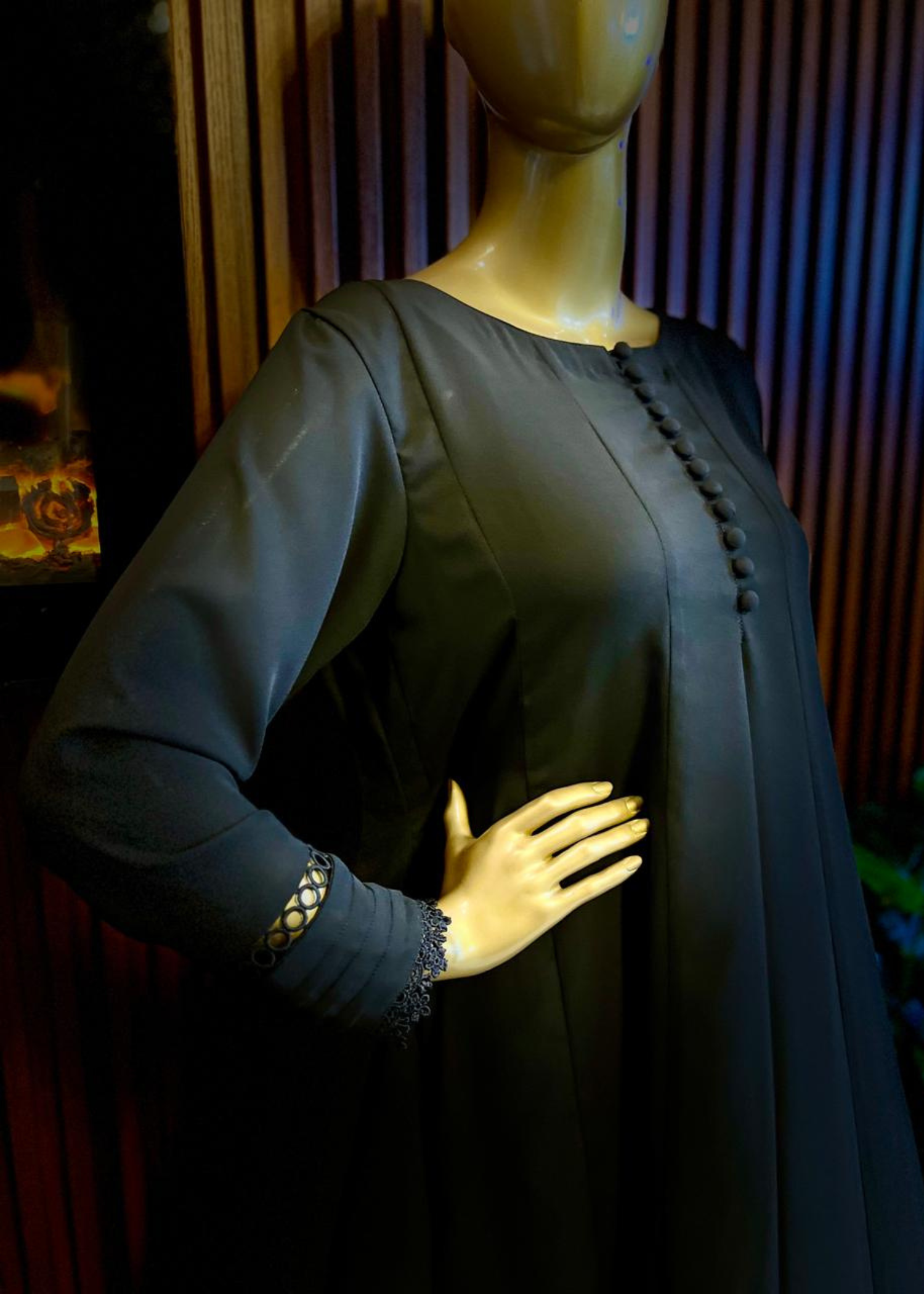 "Elegant black A-line frock with flared silhouette and delicate detailing – perfect for festive and winter occasions by Rooh-e-Maan Studios"
