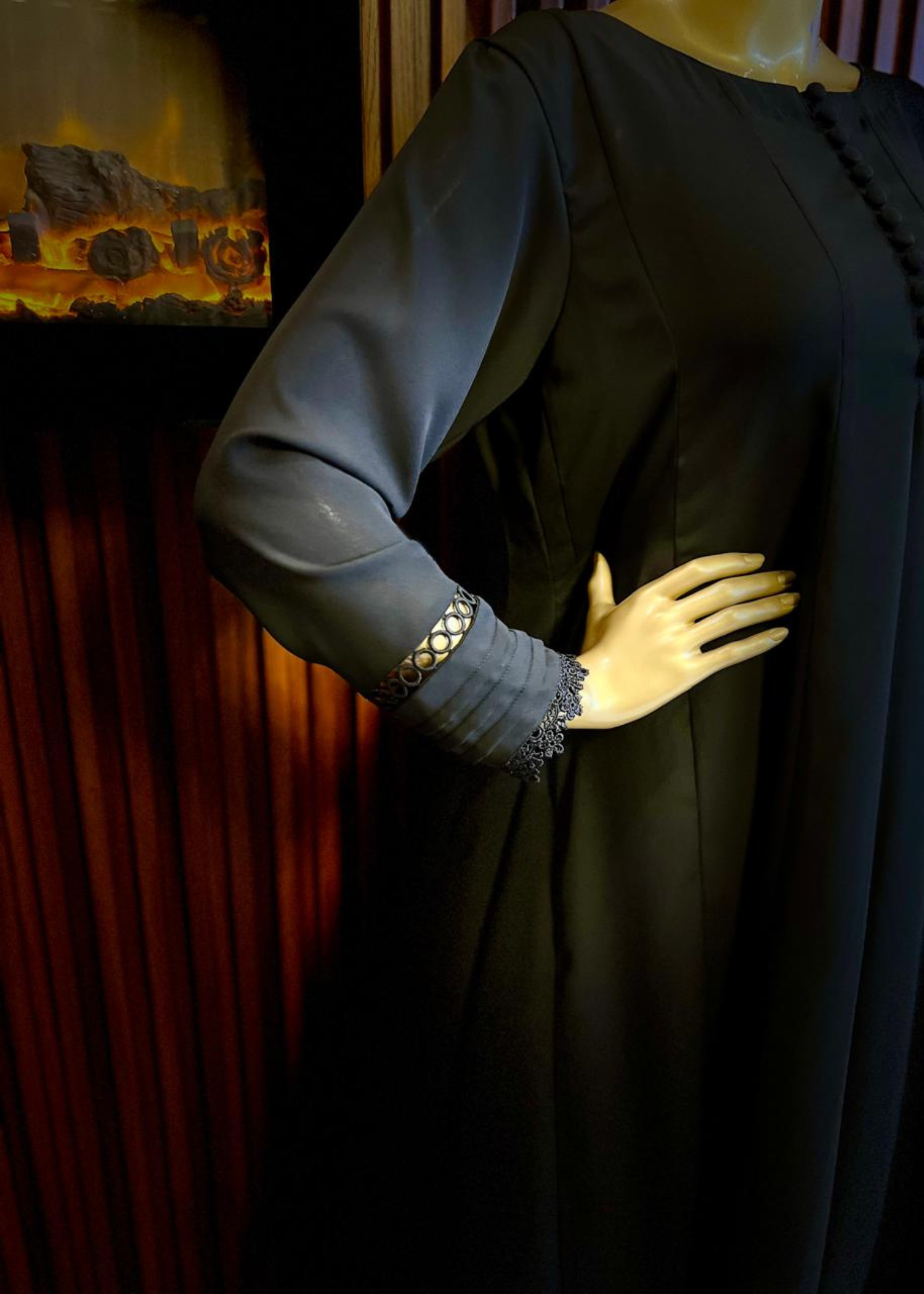 "Elegant black A-line frock with flared silhouette and delicate detailing – perfect for festive and winter occasions by Rooh-e-Maan Studios"