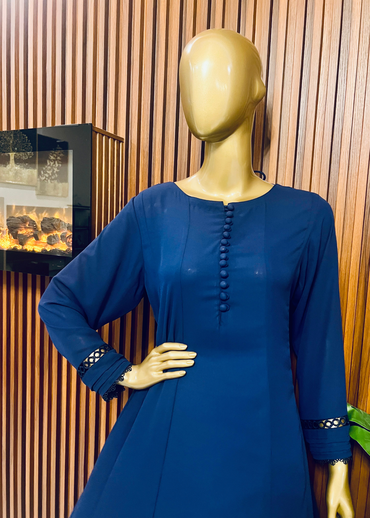 "Elegant blue A-line frock with flared silhouette and delicate detailing – perfect for festive and winter occasions by Rooh-e-Maan Studios"