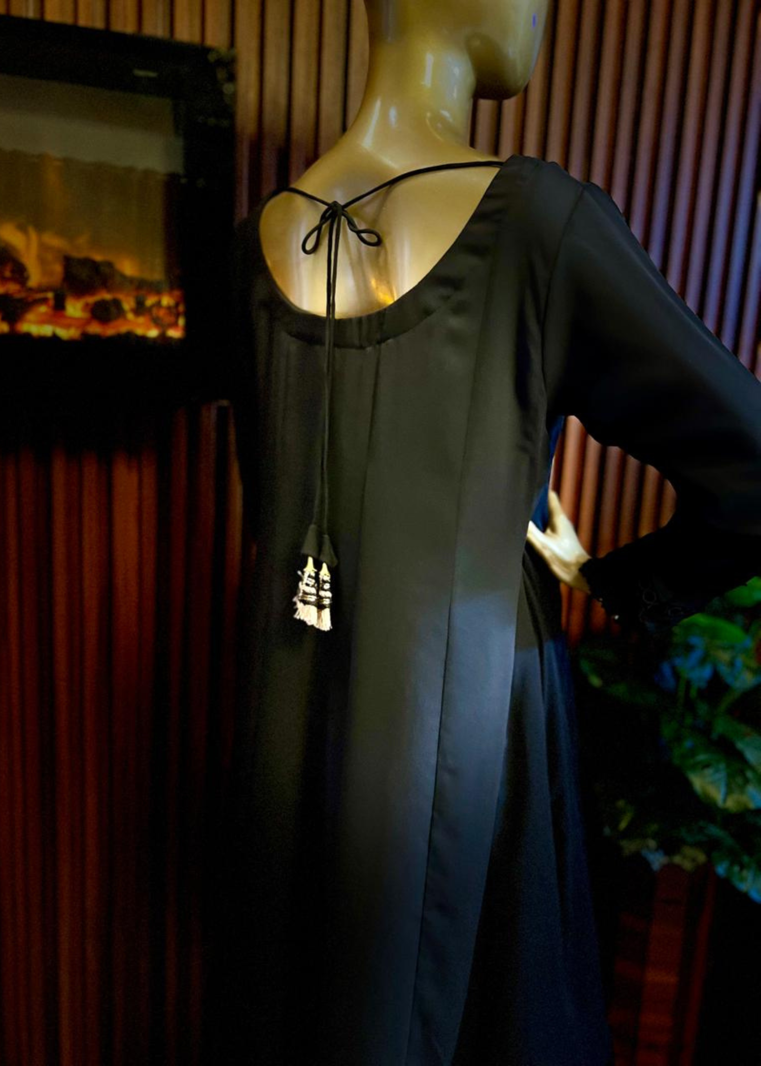 "Elegant black A-line frock with flared silhouette and delicate detailing – perfect for festive and winter occasions by Rooh-e-Maan Studios"