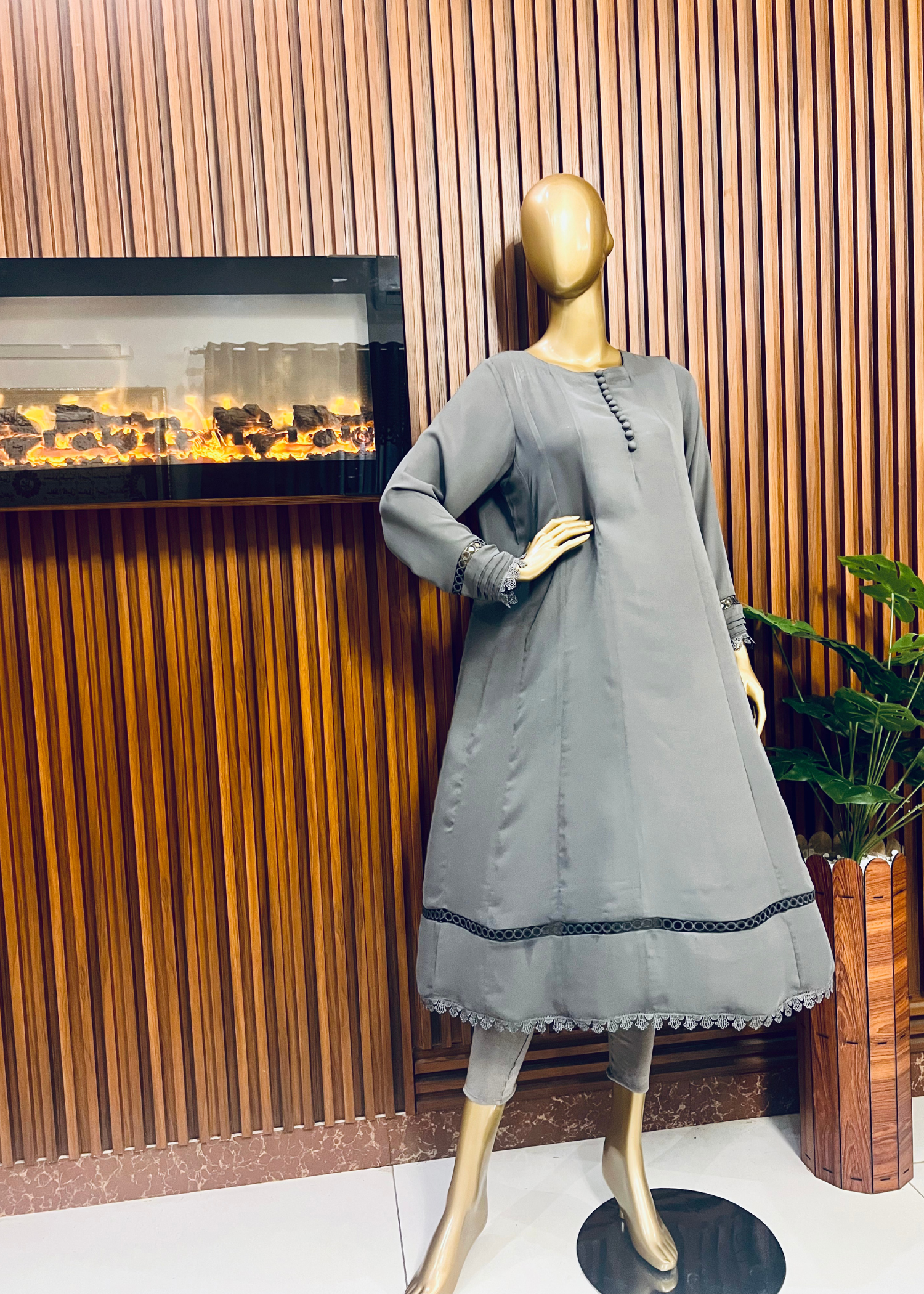 "Elegant grey A-line frock with flared silhouette and delicate detailing – perfect for festive and winter occasions by Rooh-e-Maan Studios"