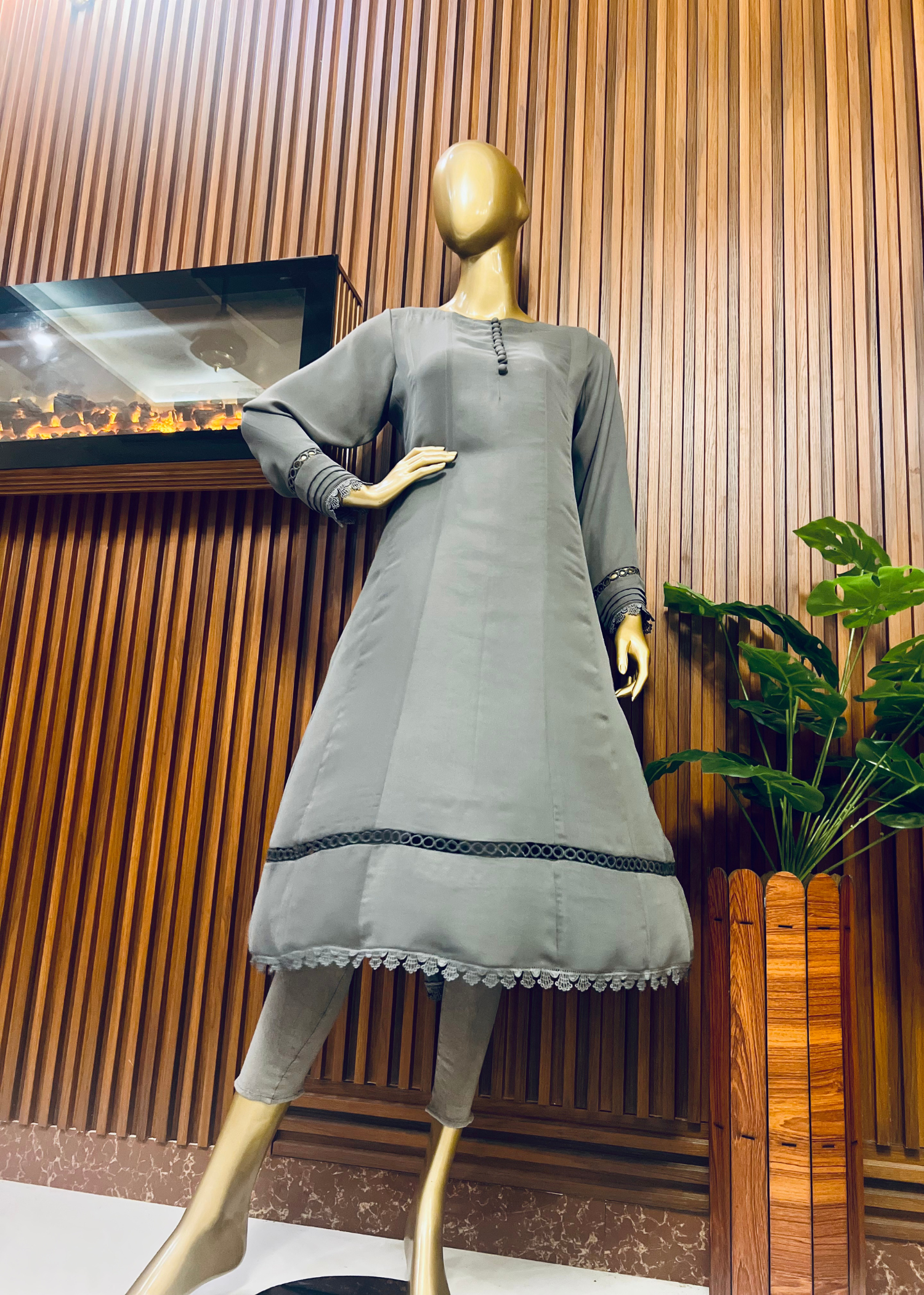 "Elegant grey A-line frock with flared silhouette and delicate detailing – perfect for festive and winter occasions by Rooh-e-Maan Studios"