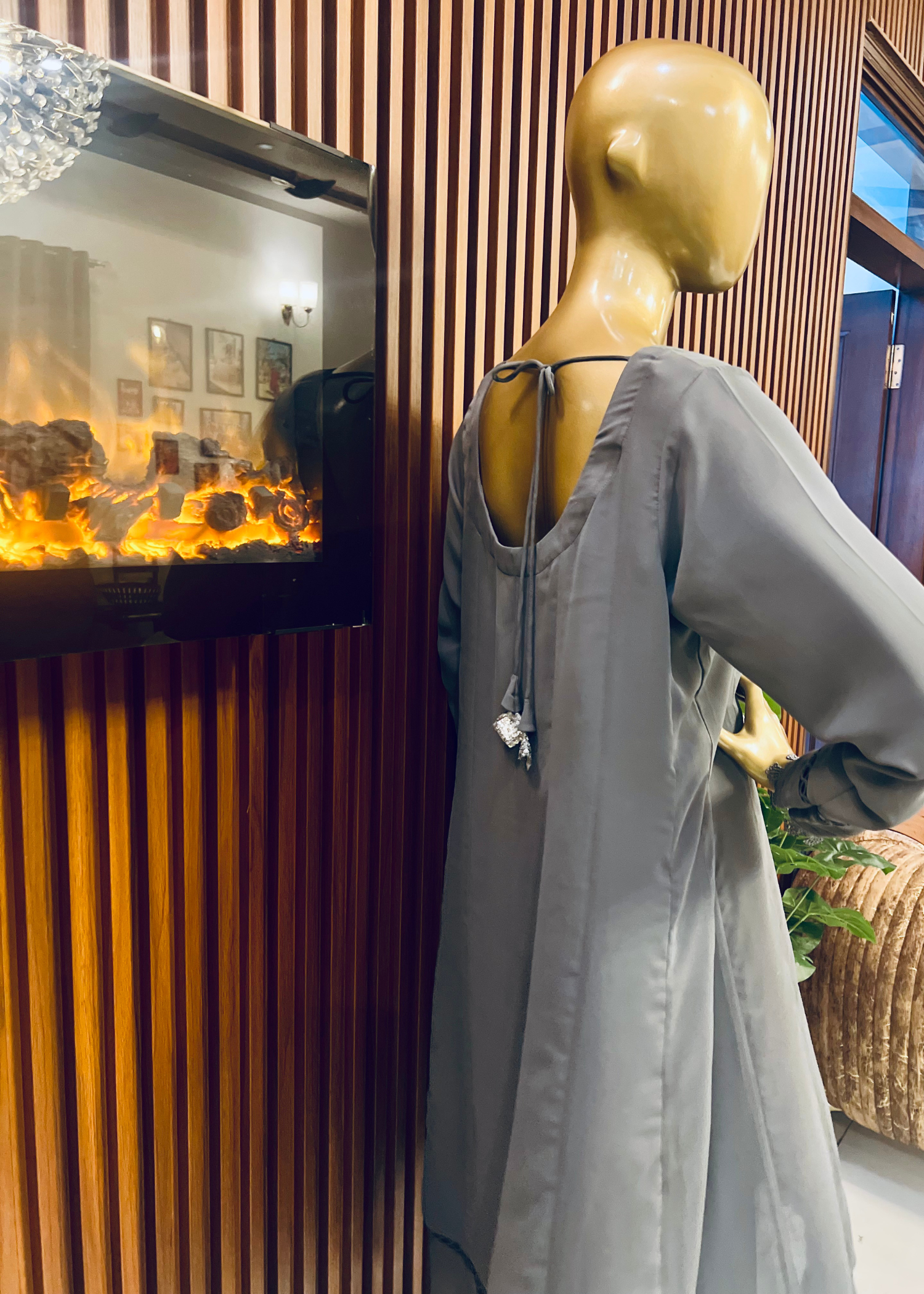 "Elegant grey A-line frock with flared silhouette and delicate detailing – perfect for festive and winter occasions by Rooh-e-Maan Studios"