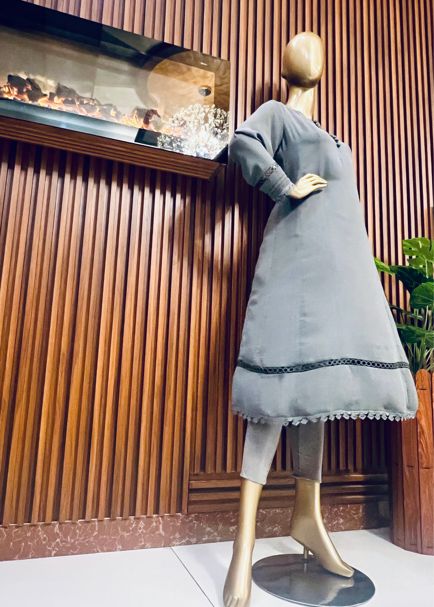 "Elegant grey A-line frock with flared silhouette and delicate detailing – perfect for festive and winter occasions by Rooh-e-Maan Studios"