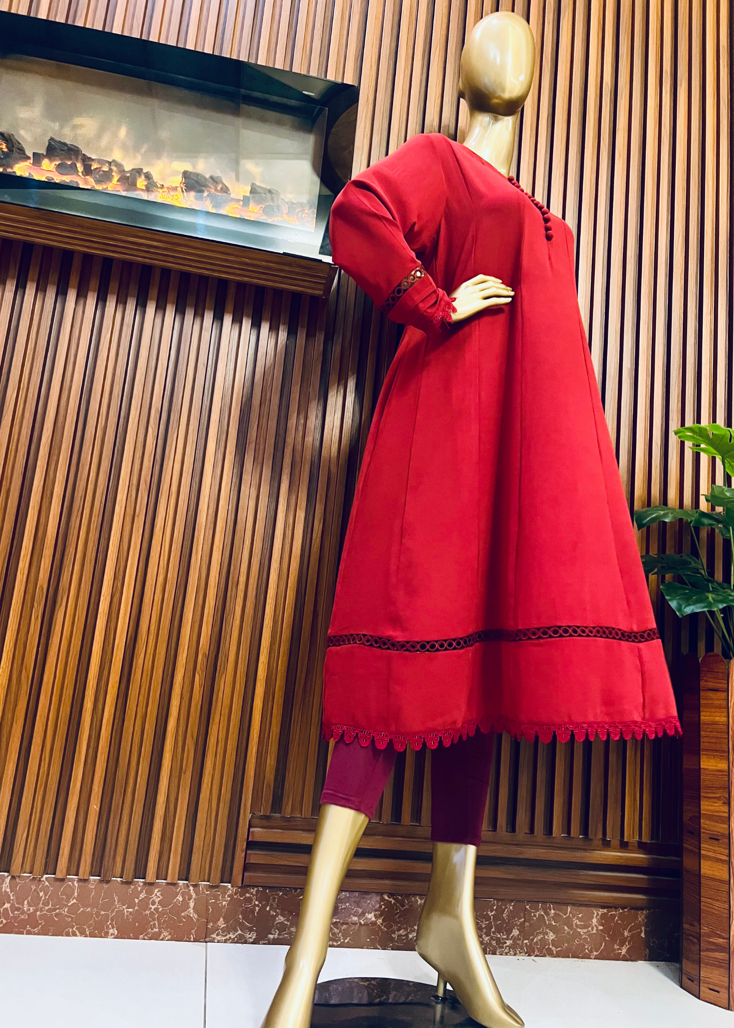 "Elegant maroon A-line frock with flared silhouette and delicate detailing – perfect for festive and winter occasions by Rooh-e-Maan Studios"