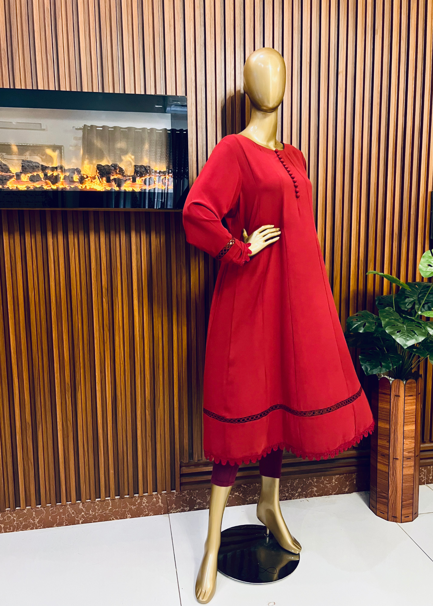 "Elegant maroon A-line frock with flared silhouette and delicate detailing – perfect for festive and winter occasions by Rooh-e-Maan Studios"