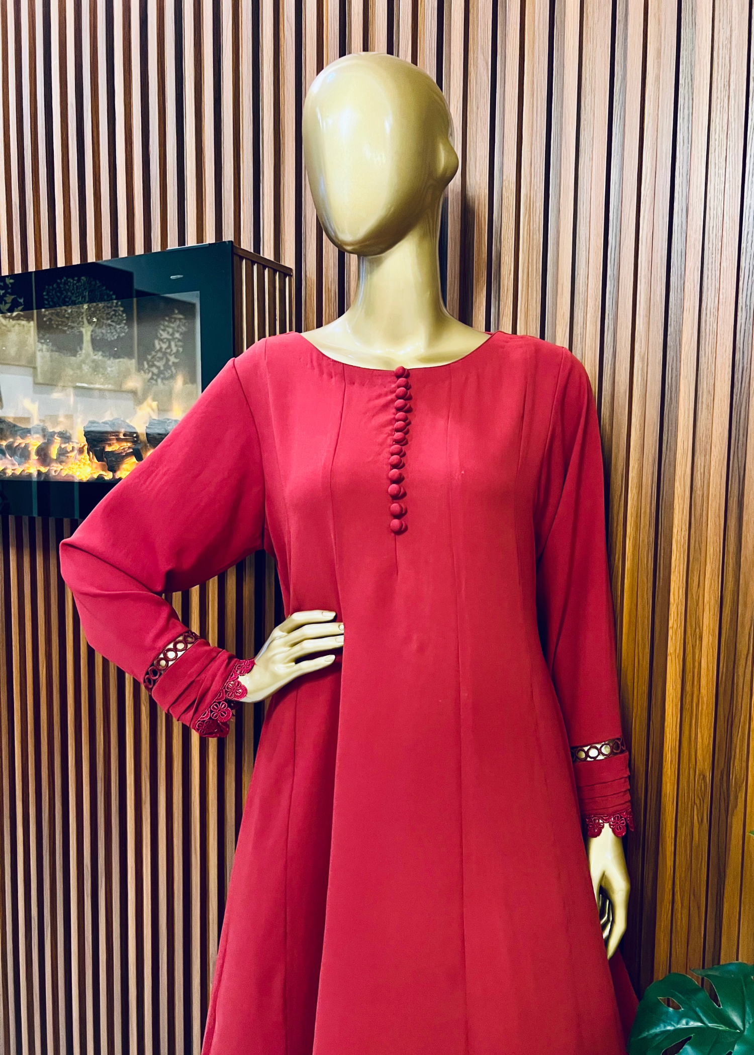 "Elegant maroon A-line frock with flared silhouette and delicate detailing – perfect for festive and winter occasions by Rooh-e-Maan Studios"
