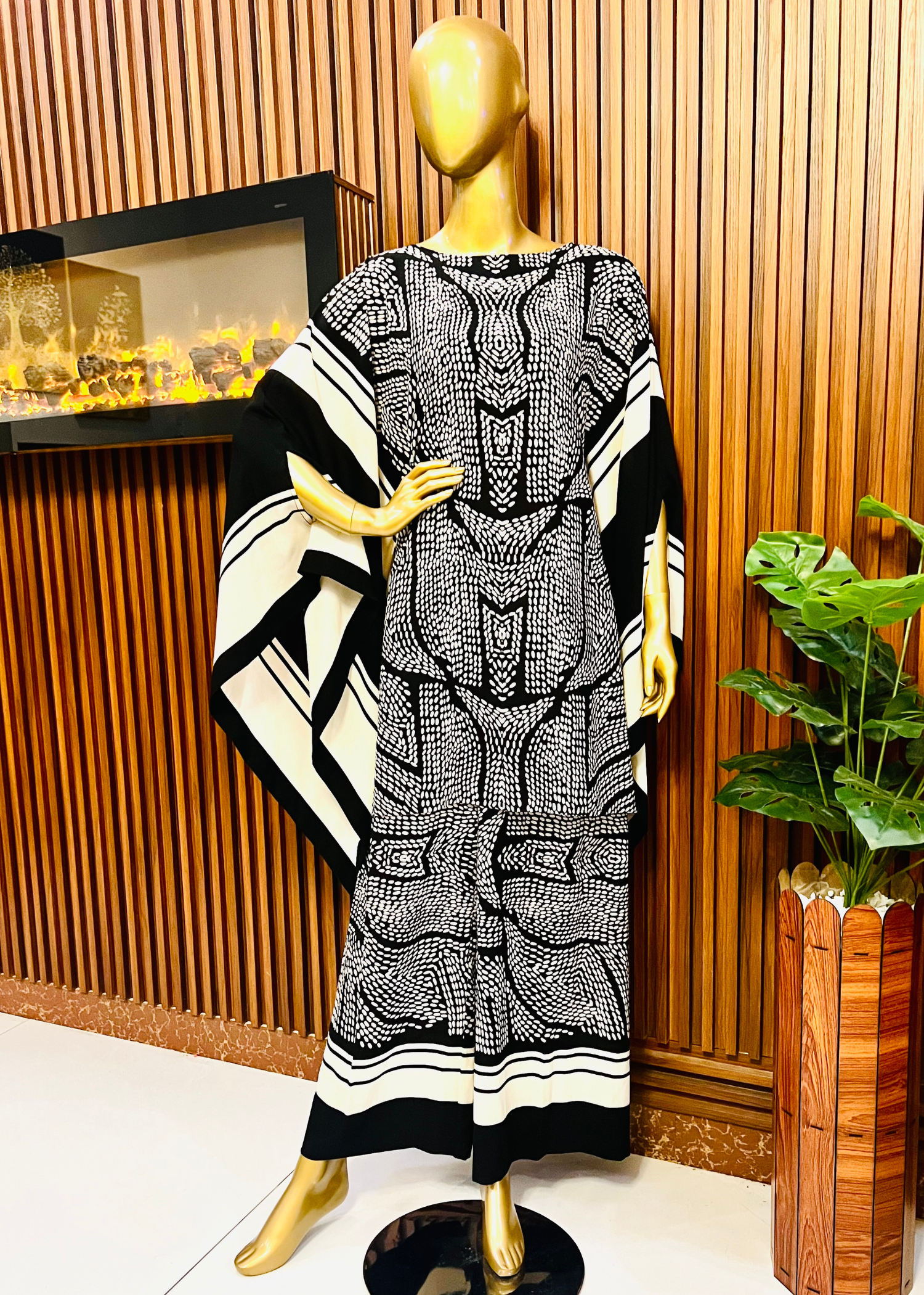 "Bold black and white printed kaftan dress for women with flowy silhouette and wide sleeves – perfect for summer elegance and modest fashion by Rooh-e-Maan Studios"