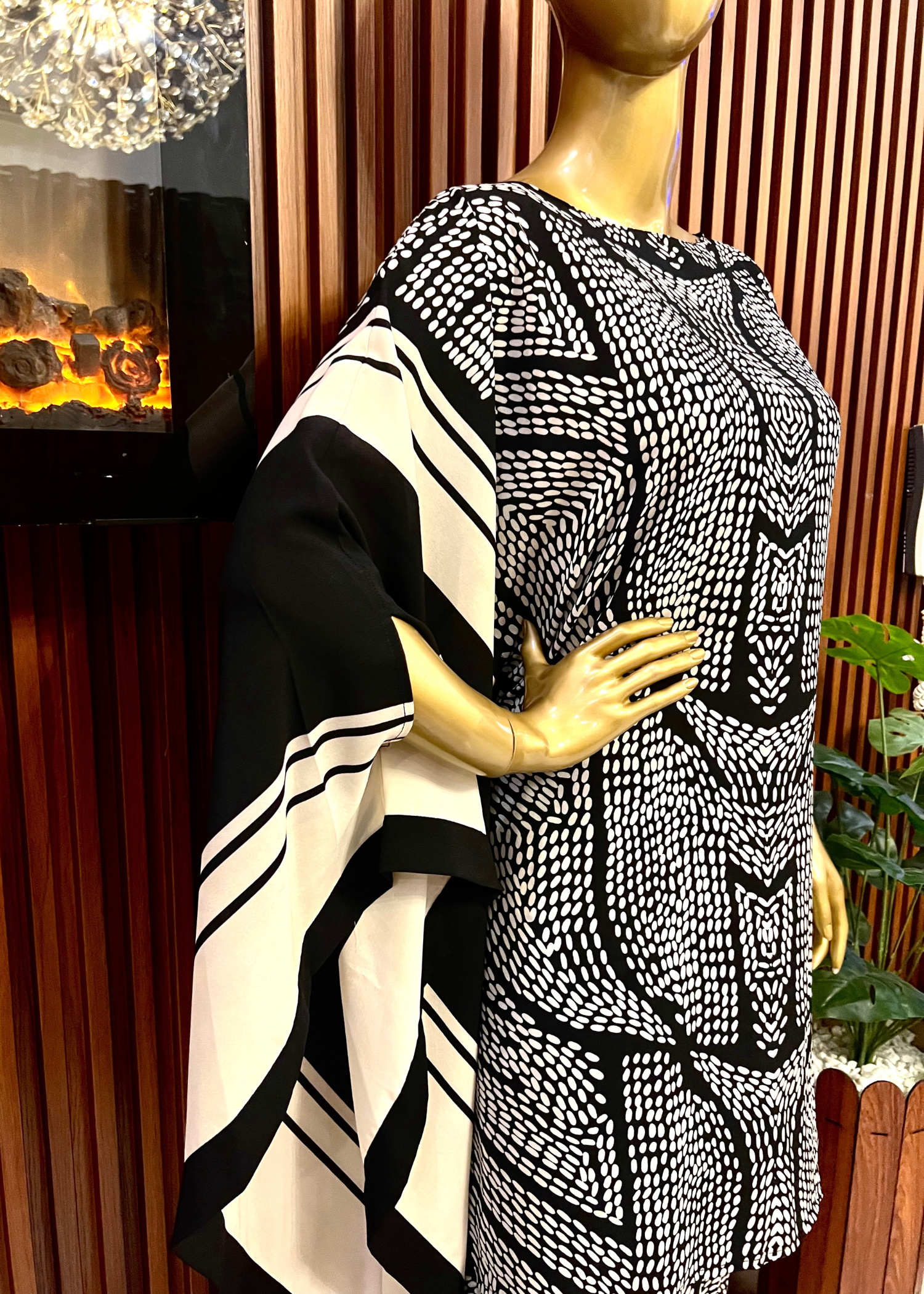 "Bold black and white printed kaftan dress for women with flowy silhouette and wide sleeves – perfect for summer elegance and modest fashion by Rooh-e-Maan Studios"