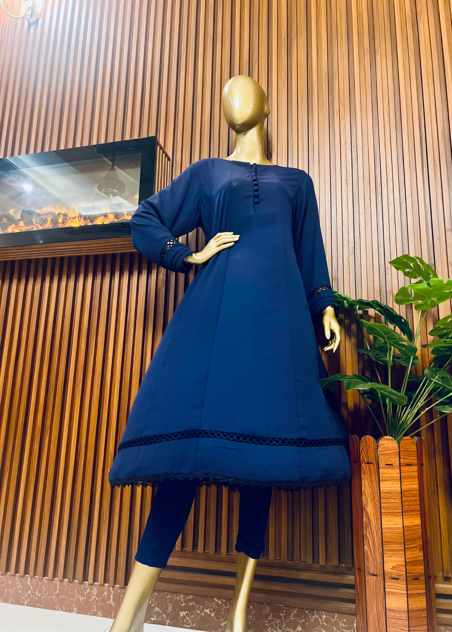 "Elegant blue A-line frock with flared silhouette and delicate detailing – perfect for festive and winter occasions by Rooh-e-Maan Studios"