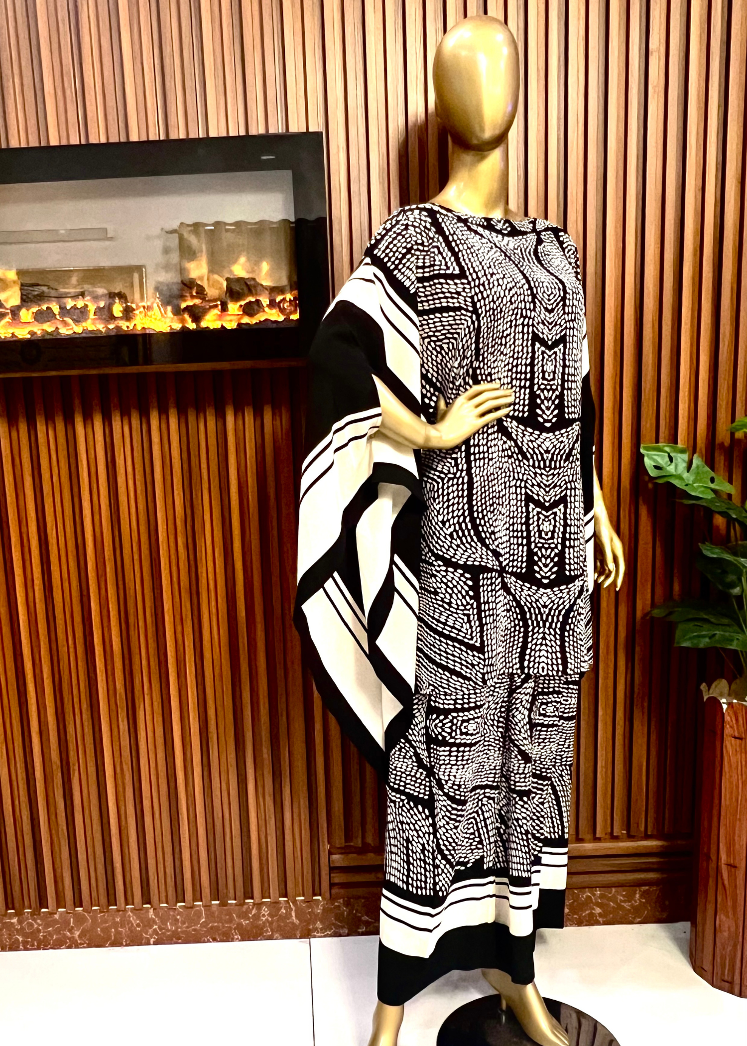 "Bold black and white printed kaftan dress for women with flowy silhouette and wide sleeves – perfect for summer elegance and modest fashion by Rooh-e-Maan Studios"