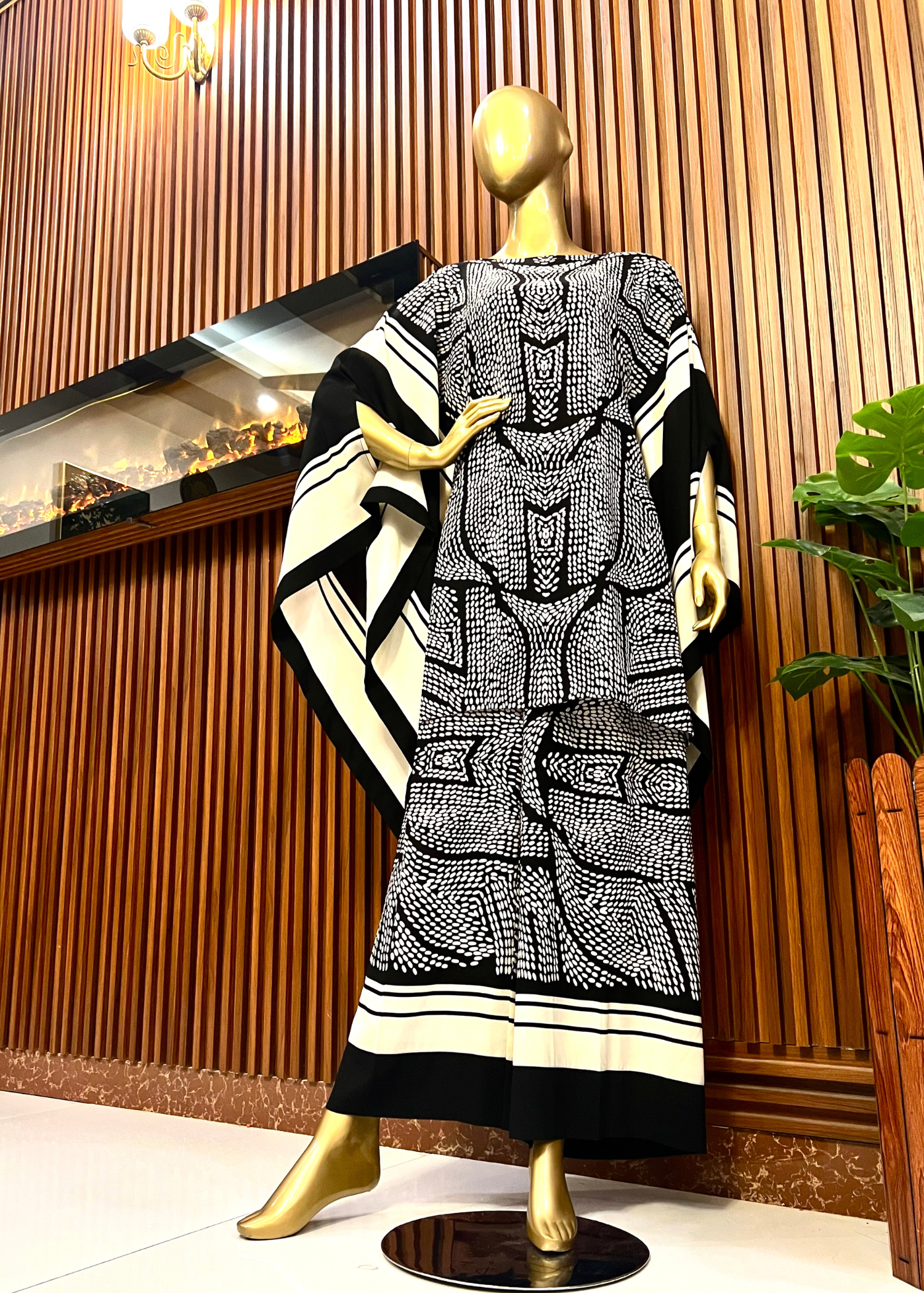 "Bold black and white printed kaftan dress for women with flowy silhouette and wide sleeves – perfect for summer elegance and modest fashion by Rooh-e-Maan Studios"