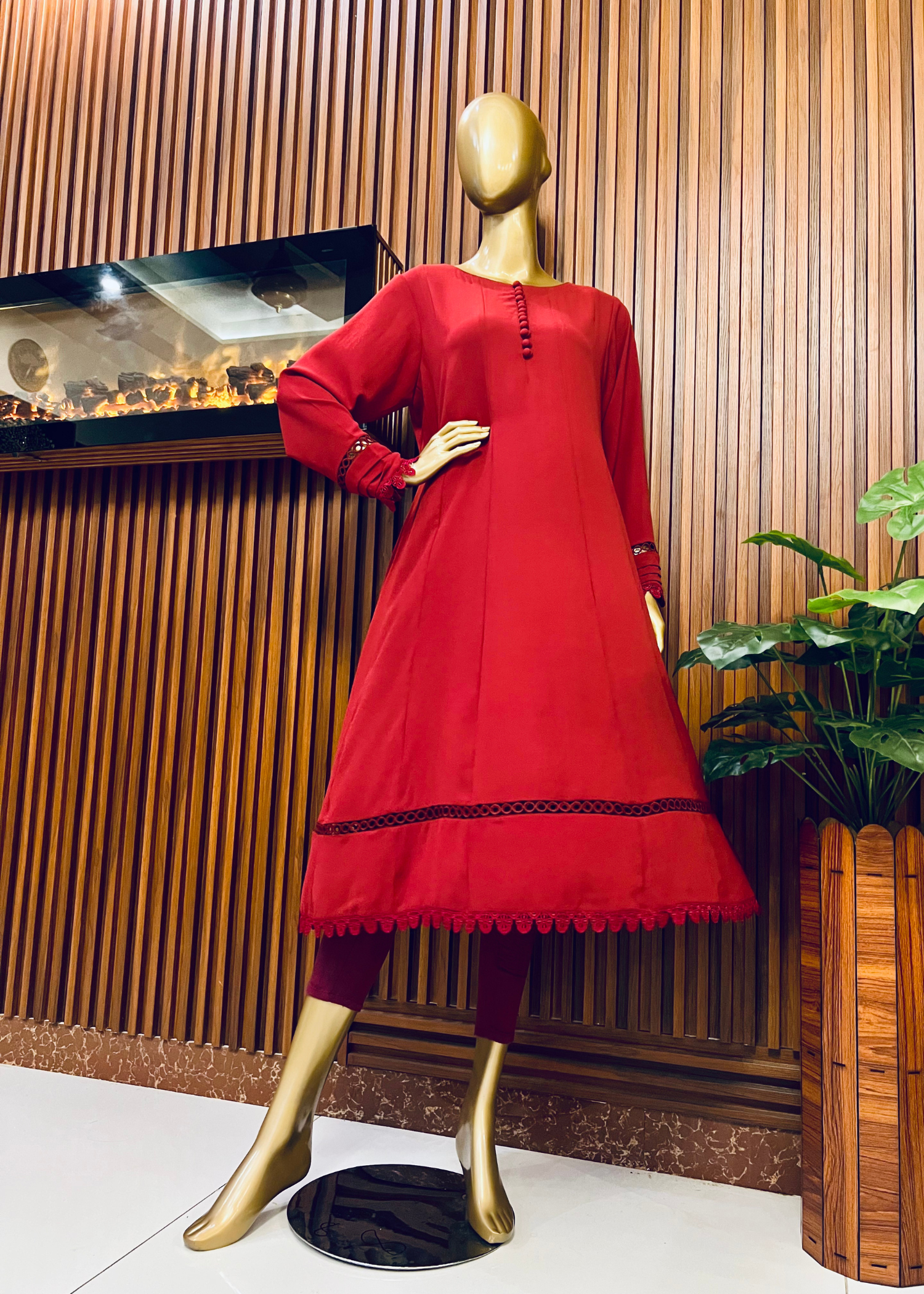 "Elegant maroon A-line frock with flared silhouette and delicate detailing – perfect for festive and winter occasions by Rooh-e-Maan Studios"